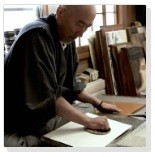 Master Printer Tatsuya Ito demonstrating woodblock printing