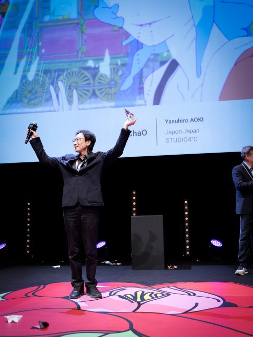 ChaO director Yasuhiro Aoki celebrates the Jury Prize win at Annecy 2025 with the creative team