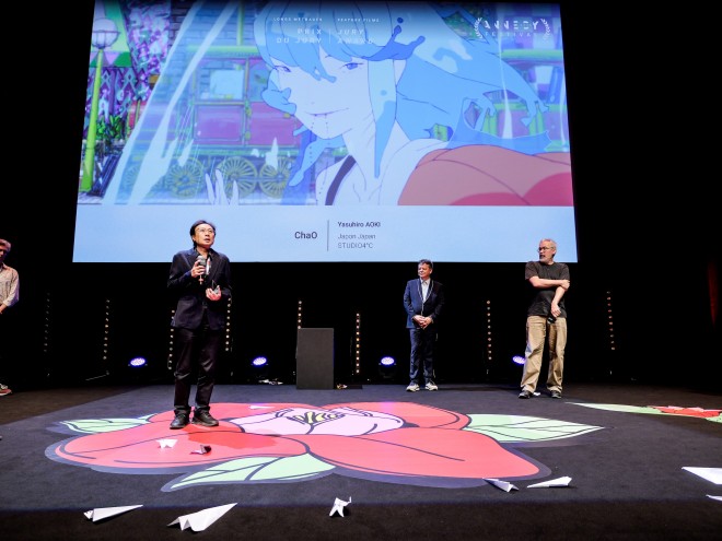 ChaO director Yasuhiro Aoki celebrates the Jury Prize win at Annecy 2025 with the creative team