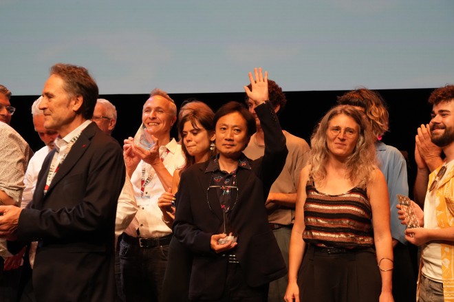 ChaO director Yasuhiro Aoki celebrates the Jury Prize win at Annecy 2025 with the creative team