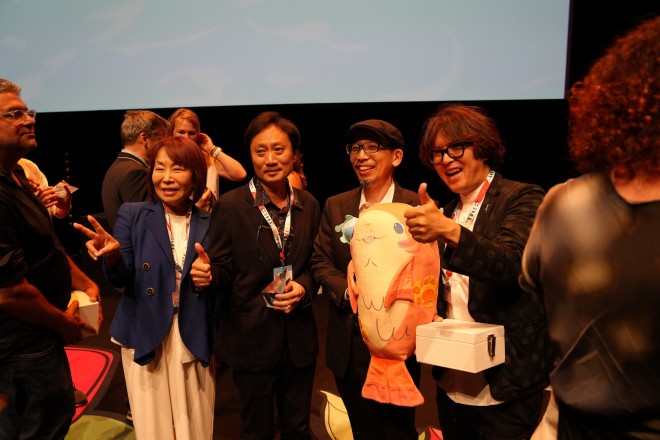 ChaO director Yasuhiro Aoki celebrates the Jury Prize win at Annecy 2025 with the creative team