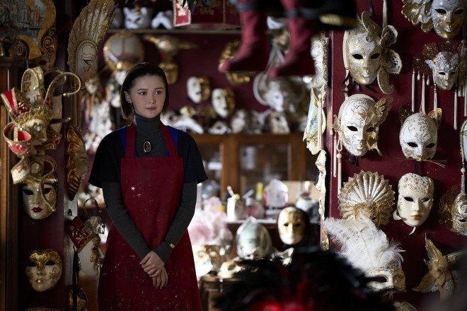 Maria (Tina Tamashiro) stands in a radiant white wedding dress during a pivotal scene from Thus Spoke Kishibe Rohan: At a Confessional, filmed at the historic San Rocco Church in Venice
