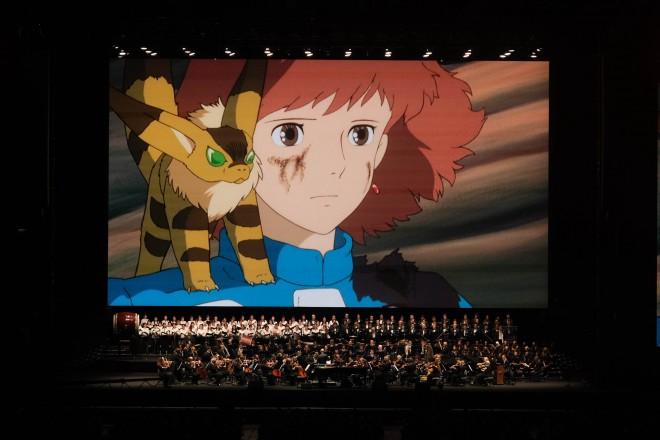Joe Hisaishi conducts the Royal Philharmonic Orchestra at the Studio Ghibli Film Concert in Tokyo Dome.