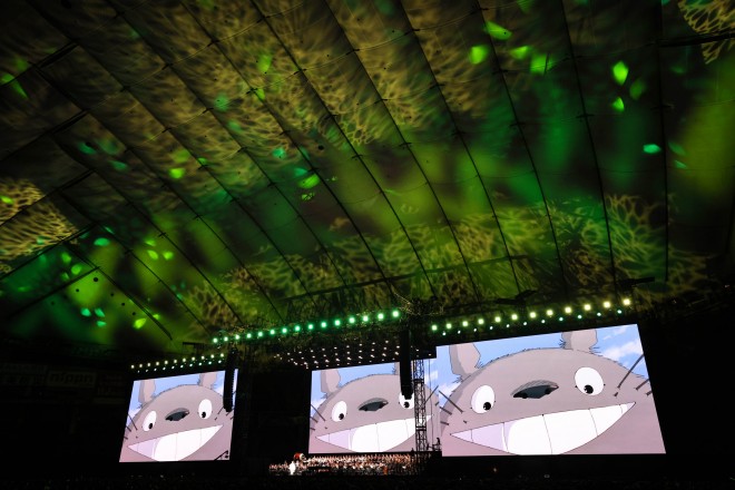 Joe Hisaishi conducts the Royal Philharmonic Orchestra at the Studio Ghibli Film Concert in Tokyo Dome.