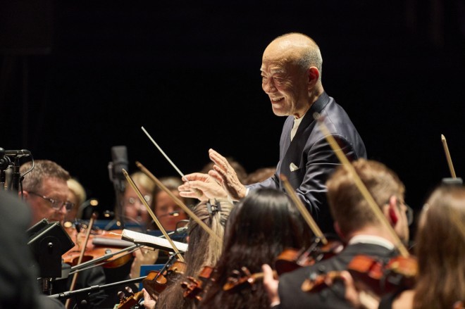 Joe Hisaishi conducts the Royal Philharmonic Orchestra at the Studio Ghibli Film Concert in Tokyo Dome.