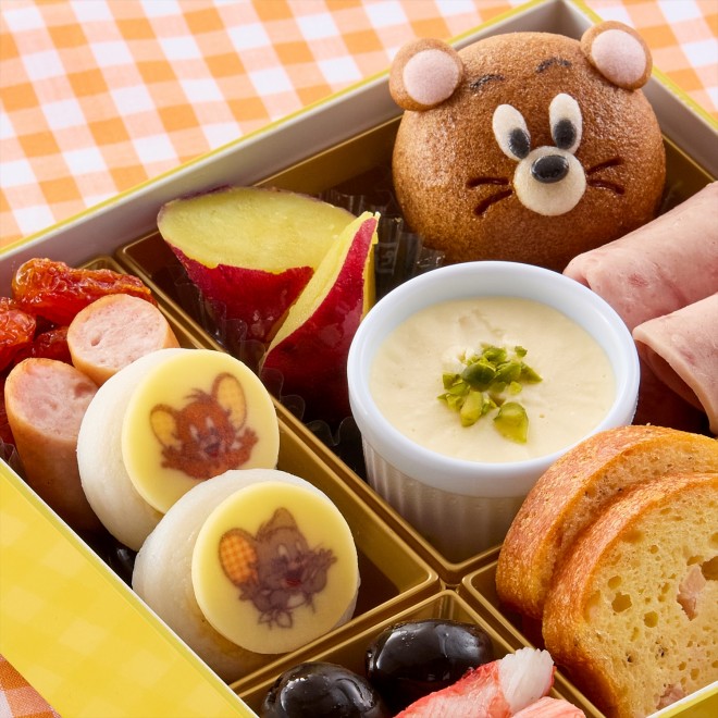 2026 two-tier Tom and Jerry Osechi set featuring traditional New Year dishes and cheese-inspired items.