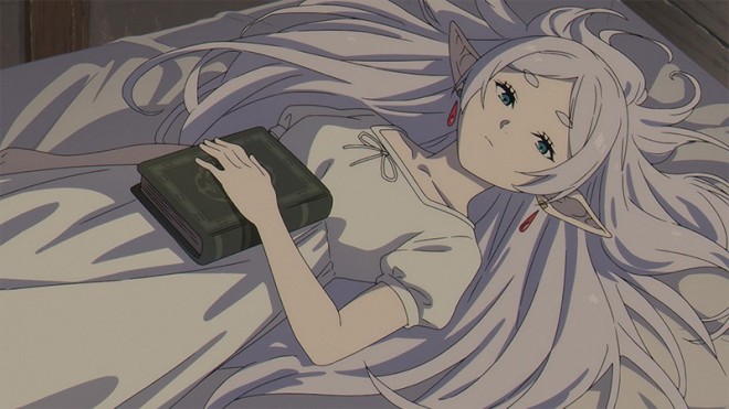 Frieren lying on a bed in her pajamas