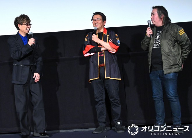 Cast and staff appear on stage 